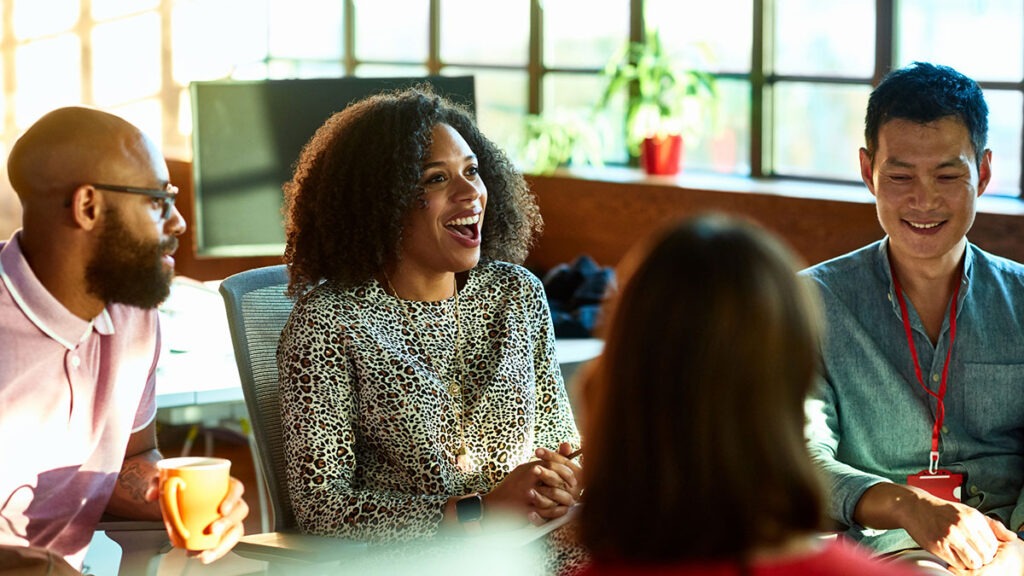 Image of co-workers in group talking