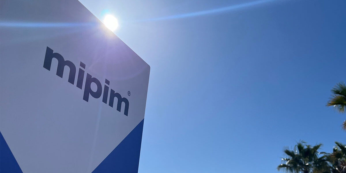 MIPIM signage with sun shining